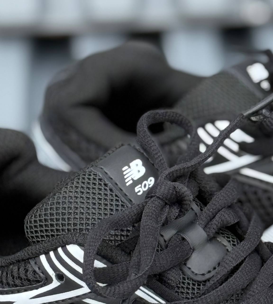 New Balance 509 negra blanca