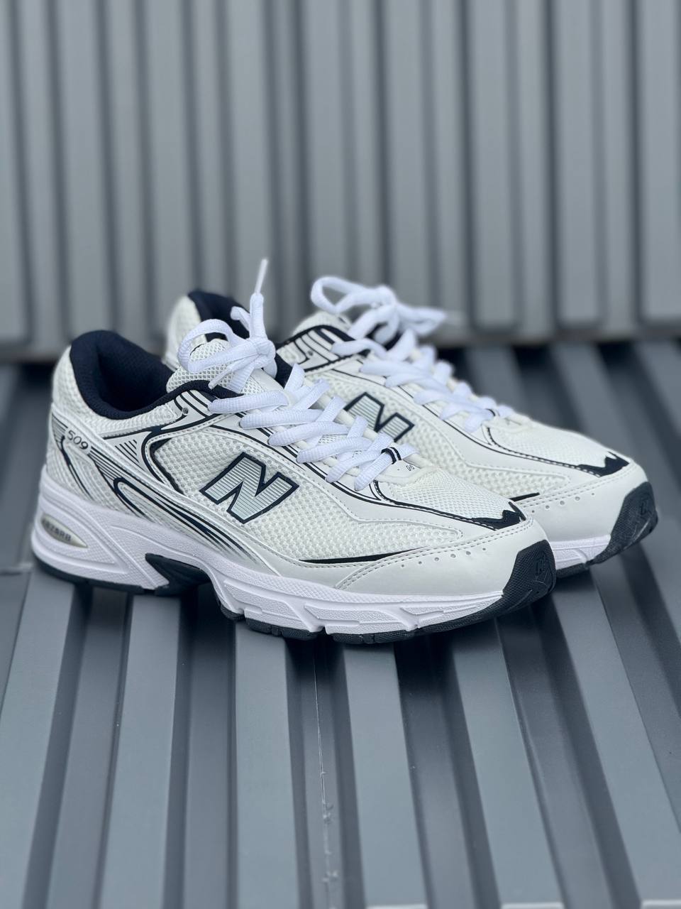 New Balance 509 blanca azul