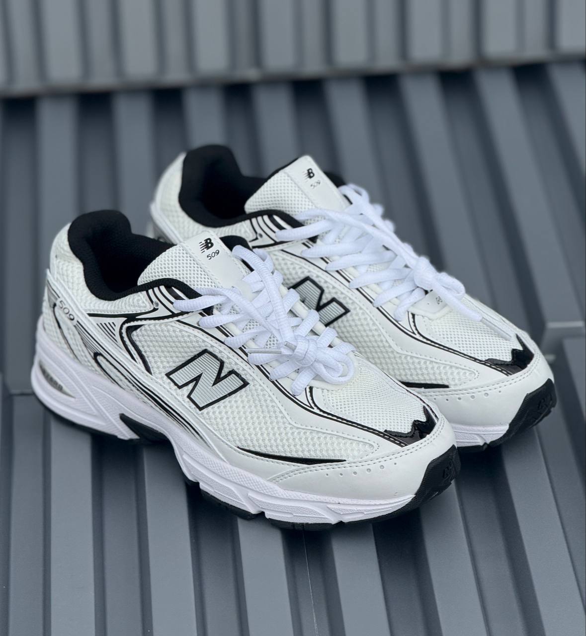 New Balance 509 blanca negra