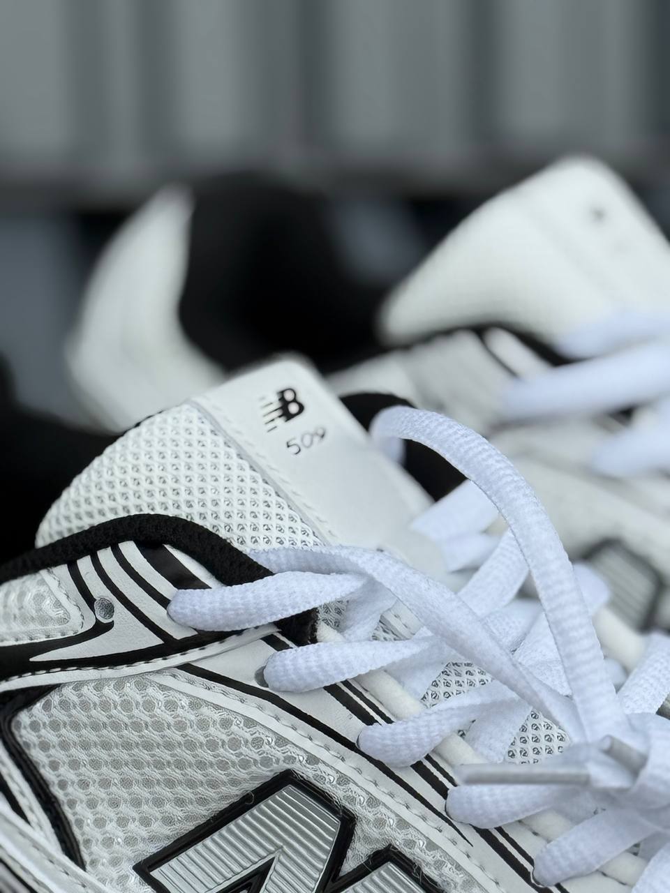 New Balance 509 blanca negra
