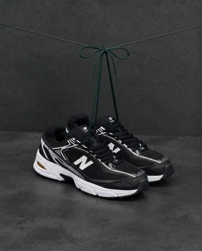 New Balance 509 negra blanca