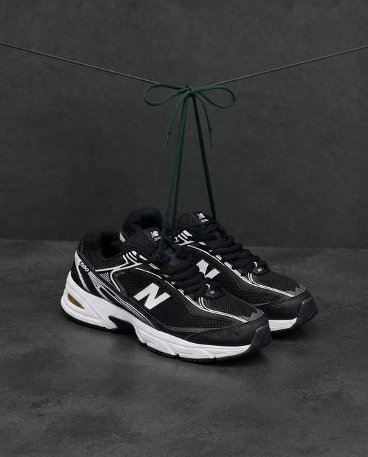 New Balance 509 negra blanca