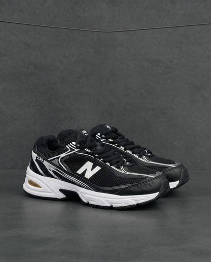 New Balance 509 negra blanca