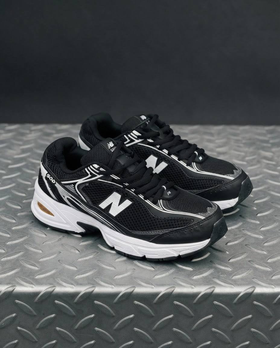 New Balance 509 negra blanca