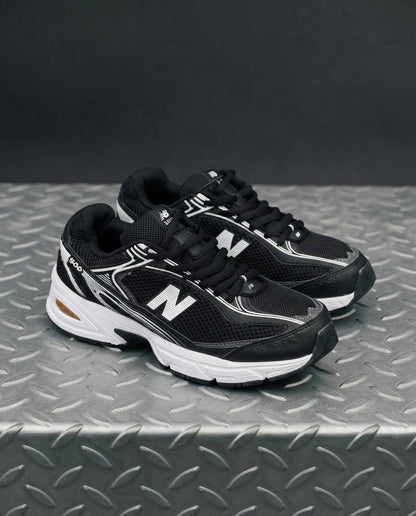 New Balance 509 negra blanca