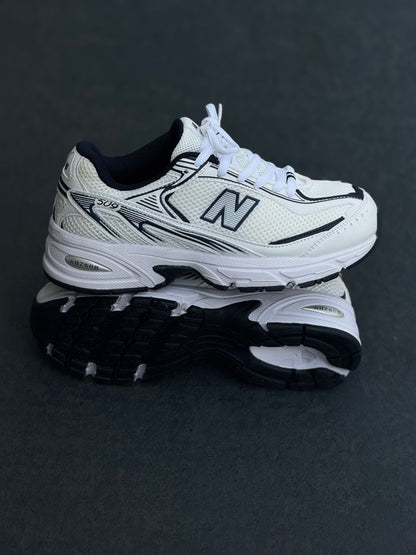 New Balance 509 blanca azul