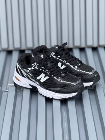 New Balance 509 negra blanca