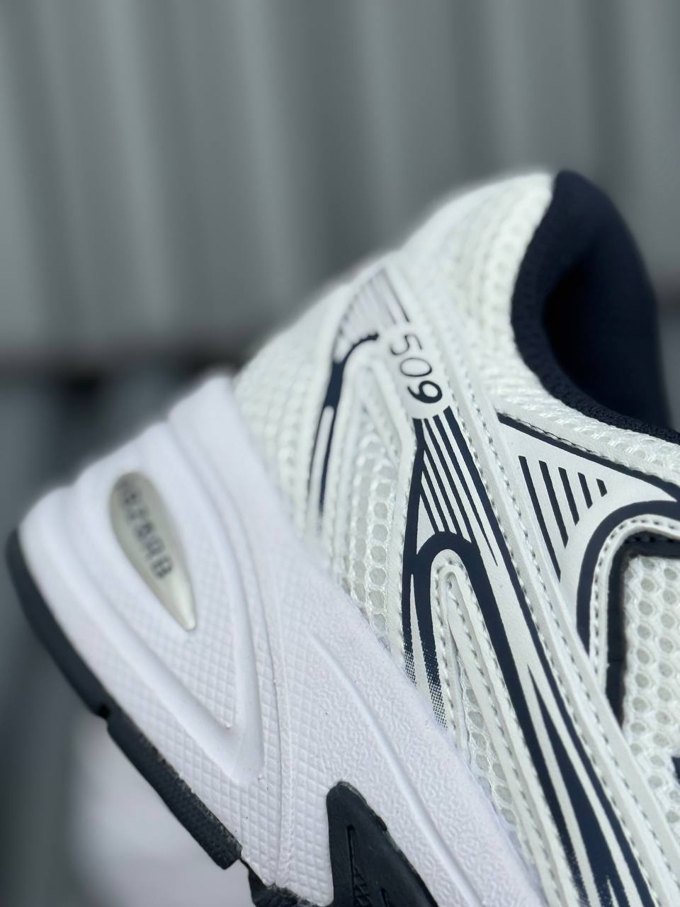 New Balance 509 blanca azul