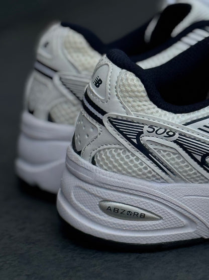 New Balance 509 blanca azul