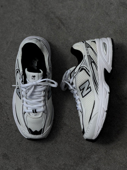New Balance 509 blanca negra