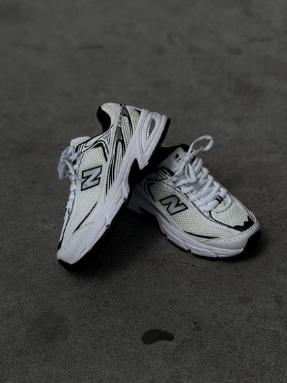 New Balance 509 blanca negra