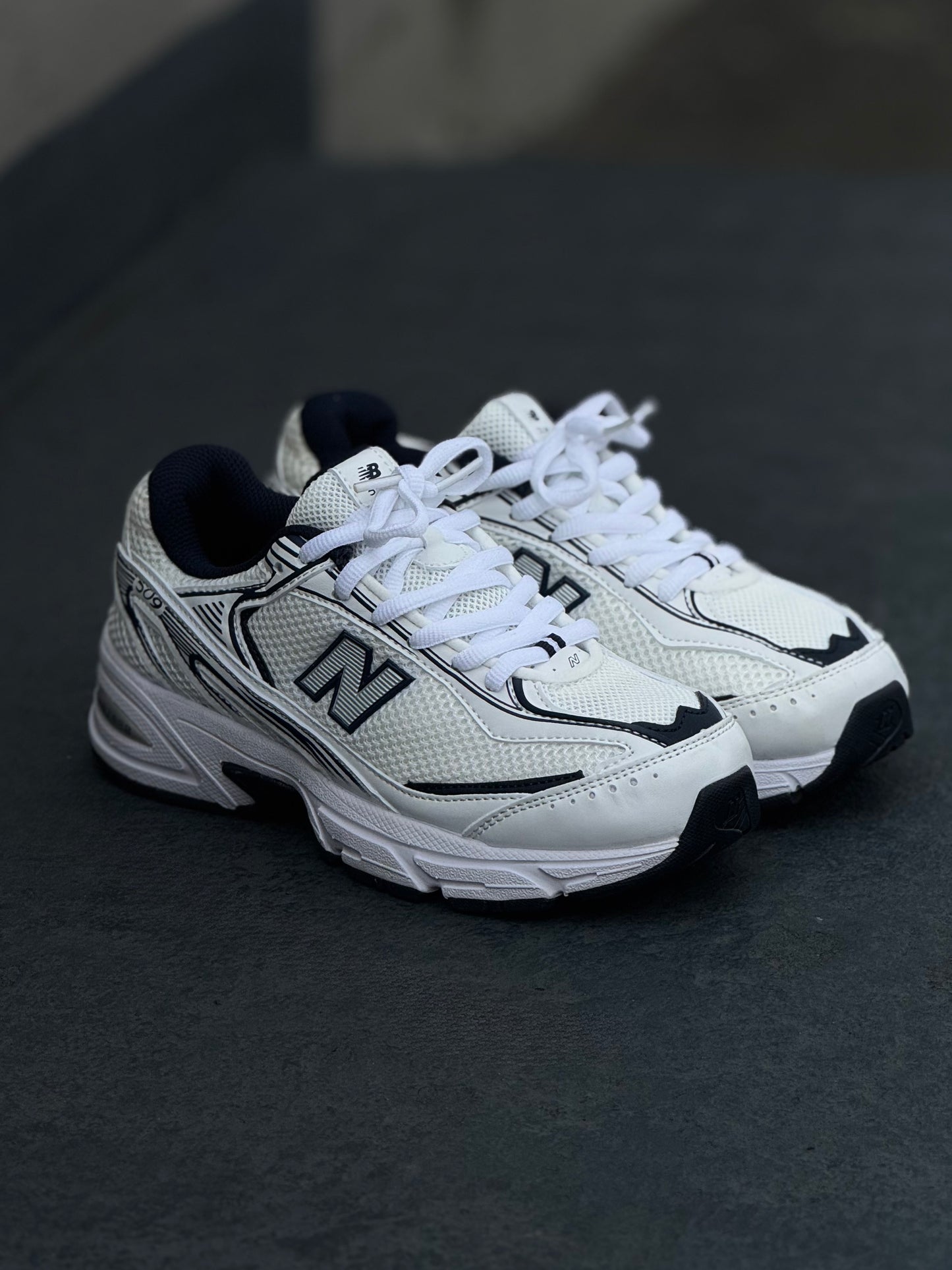 New Balance 509 blanca azul