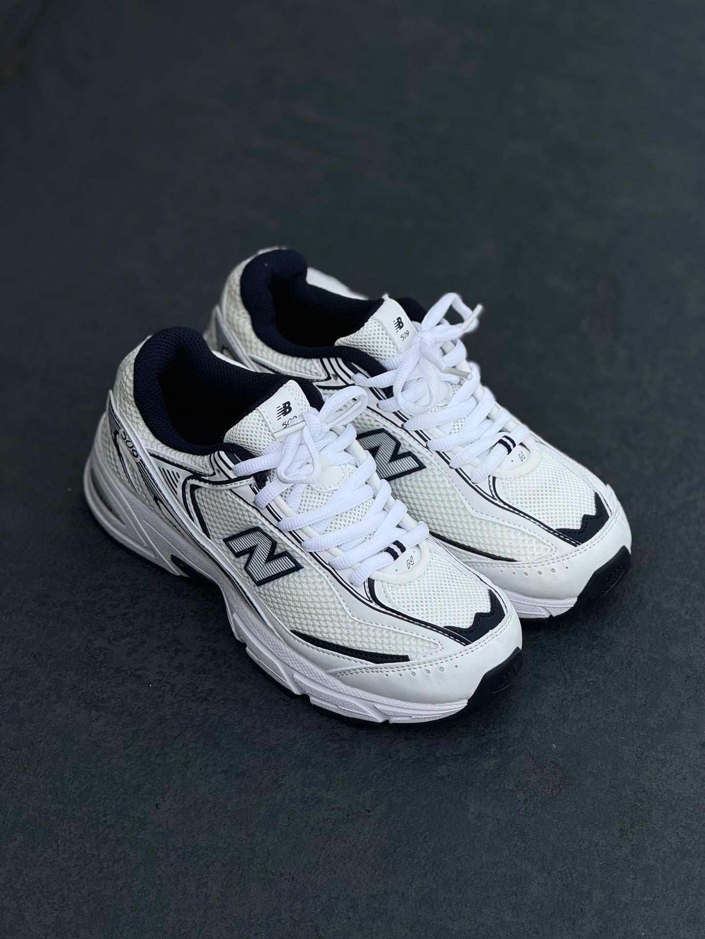 New Balance 509 blanca azul