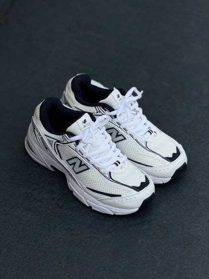 New Balance 509 blanca azul