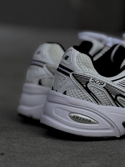 New Balance 509 blanca negra
