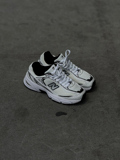 New Balance 509 blanca negra
