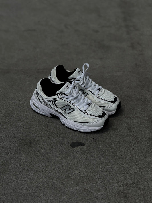 New Balance 509 blanca negra