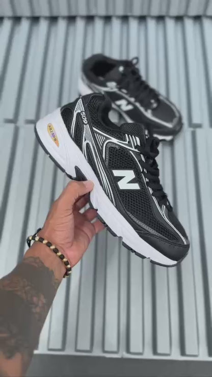New Balance 509 negra blanca